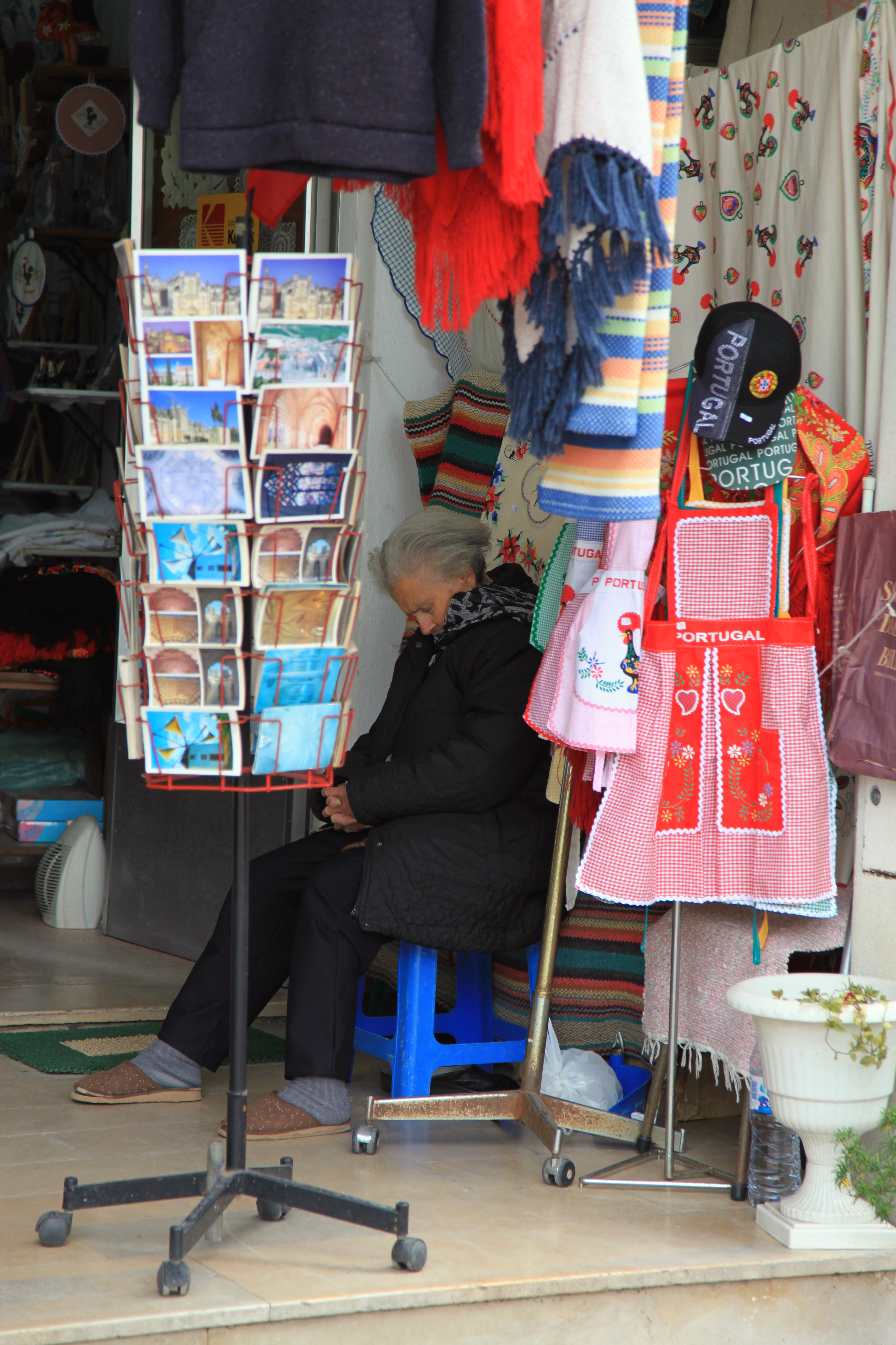 Woman Sleeping outside a shop. Presumably not dead
