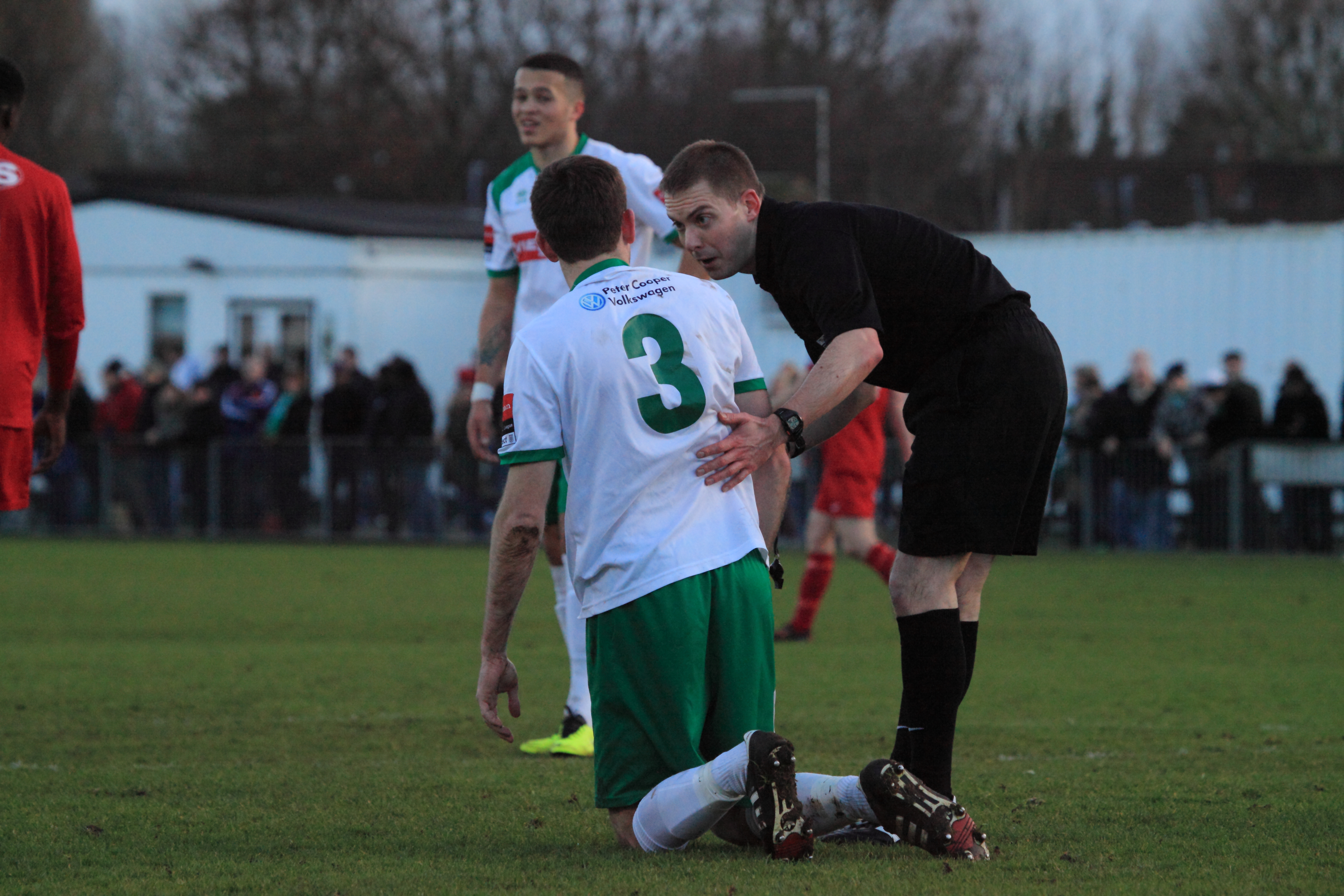 Anthony Moore the referee checking James Crane is fine