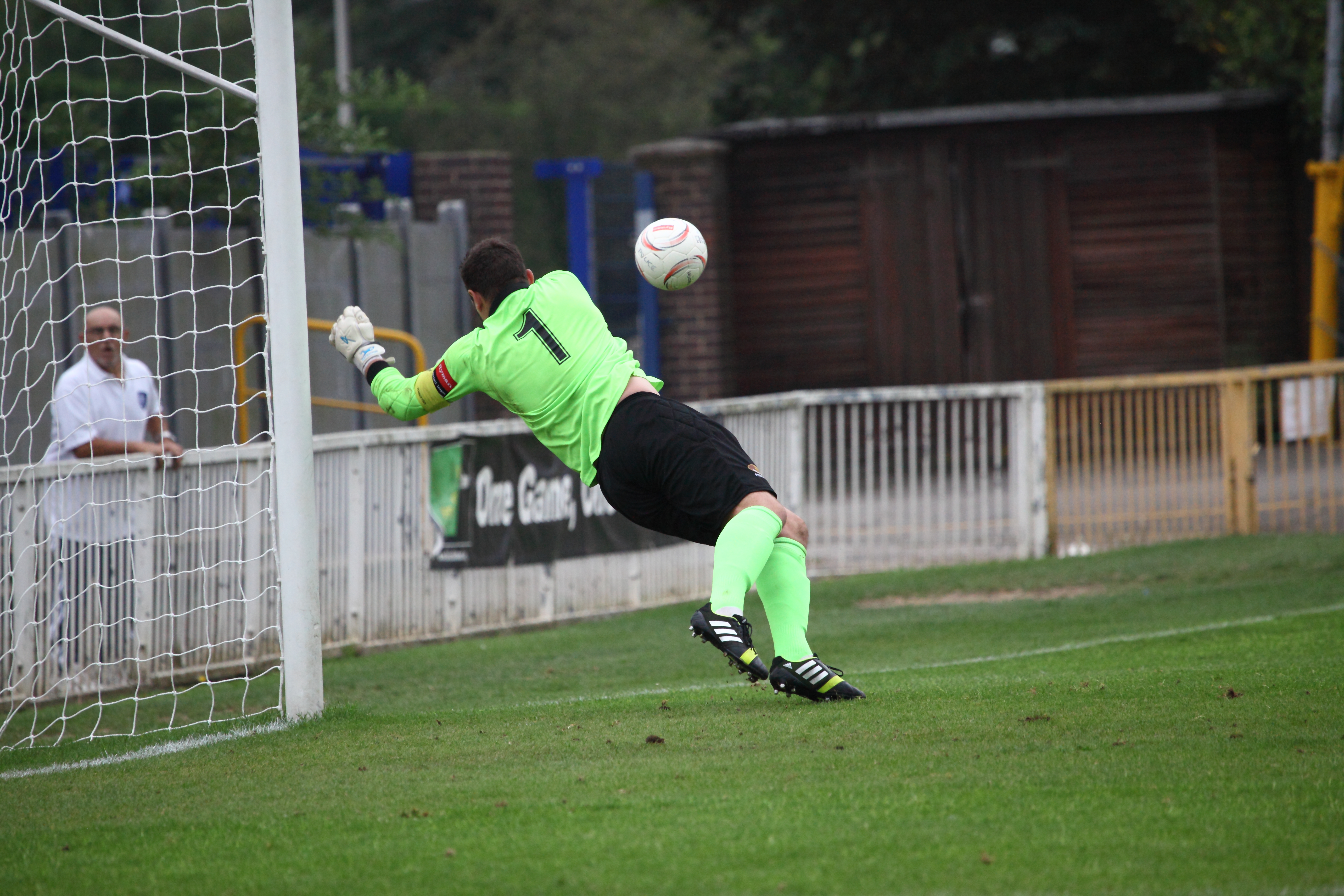 Marcus Garnham Saves a shot. Referee gives goal kick